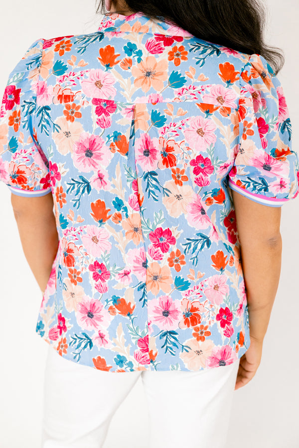 Chic Soul plus size clothing, light blue short sleeve top with pink red and orange floral design through top and blue white and pink stripe hemline along the bottom of the sleeves and bordering the v-neckline