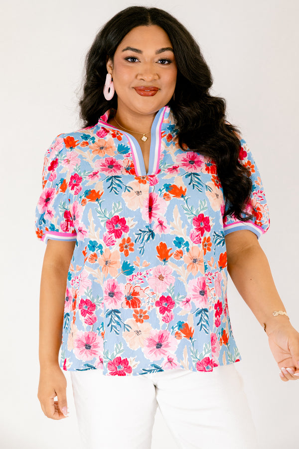 Chic Soul plus size clothing, light blue short sleeve top with pink red and orange floral design through top and blue white and pink stripe hemline along the bottom of the sleeves and bordering the v-neckline