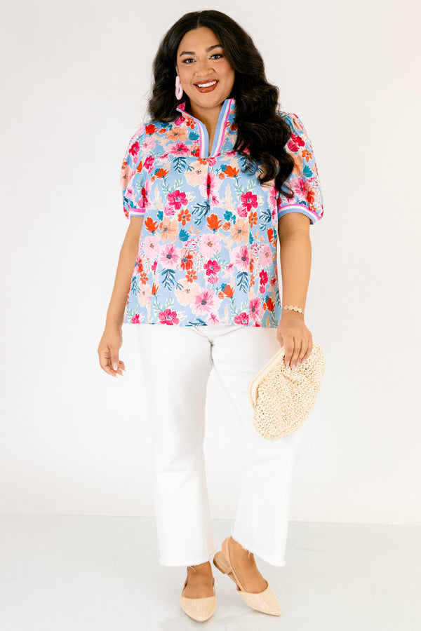 Chic Soul plus size clothing, light blue short sleeve top with pink red and orange floral design through top and blue white and pink stripe hemline along the bottom of the sleeves and bordering the v-neckline