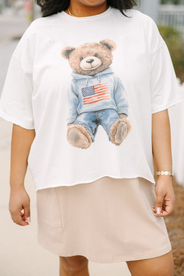 Chic Soul plus size clothing, white short sleeve graphic tee with a teddy bear graphic on the center of the shirt that is wearing an American flag pullover and jeans 