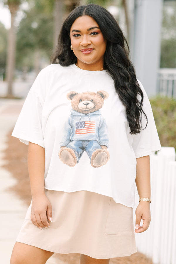 Chic Soul plus size clothing, white short sleeve graphic tee with a teddy bear graphic on the center of the shirt that is wearing an American flag pullover and jeans 
