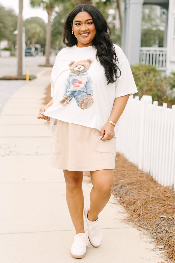 Chic Soul plus size clothing, white short sleeve graphic tee with a teddy bear graphic on the center of the shirt that is wearing an American flag pullover and jeans 