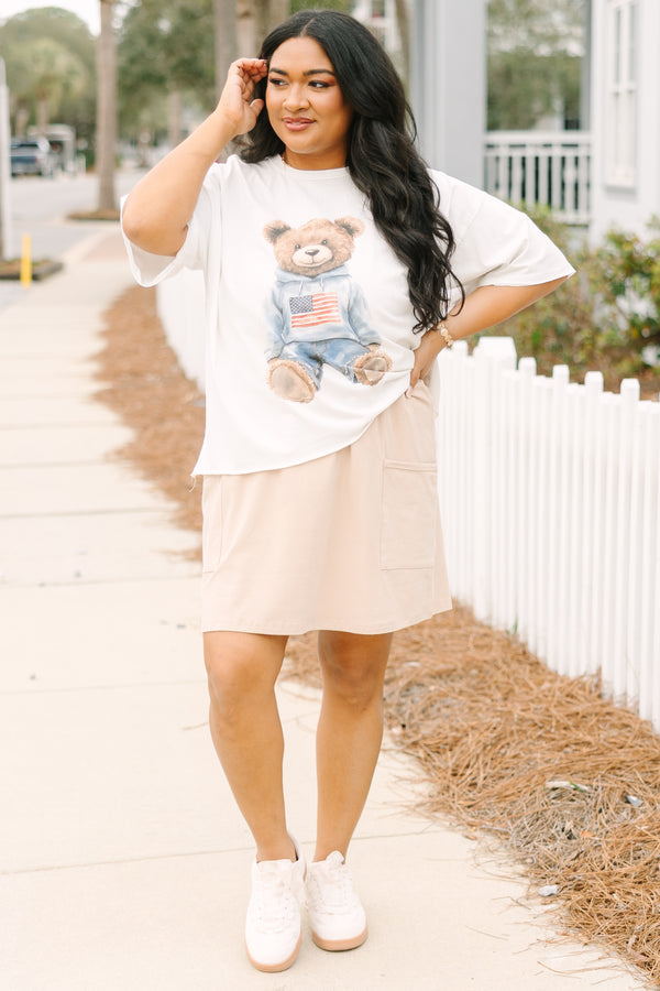 Chic Soul plus size clothing, white short sleeve graphic tee with a teddy bear graphic on the center of the shirt that is wearing an American flag pullover and jeans 