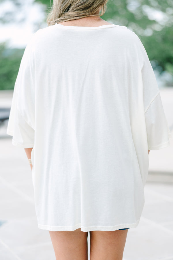 Plus Size ivory boyfriend tee with a blue sardine graphic and red text, paired with denim shorts.