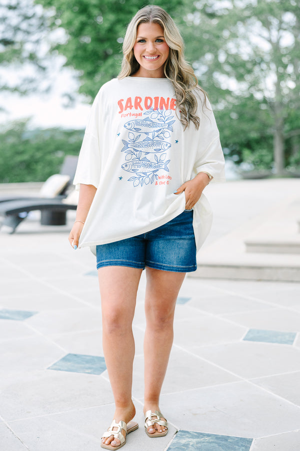 Plus Size ivory boyfriend tee with a blue sardine graphic and red text, paired with denim shorts.