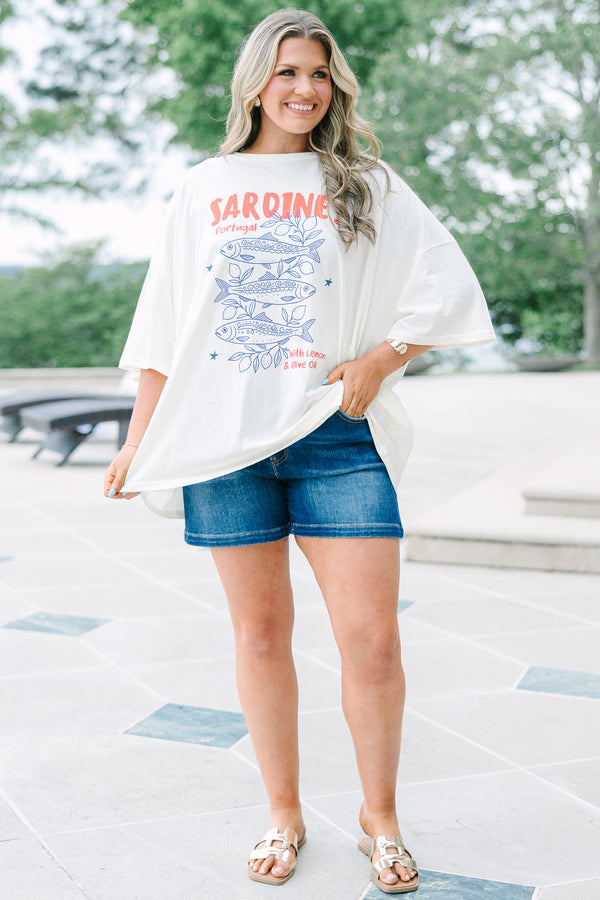 Plus Size ivory boyfriend tee with a blue sardine graphic and red text, paired with denim shorts.