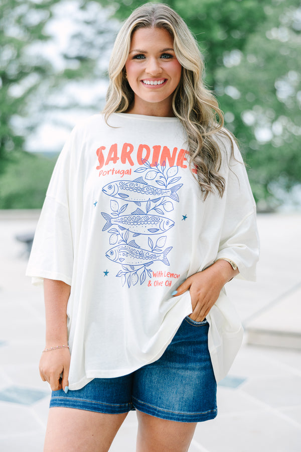Plus Size ivory boyfriend tee with a blue sardine graphic and red text, paired with denim shorts.