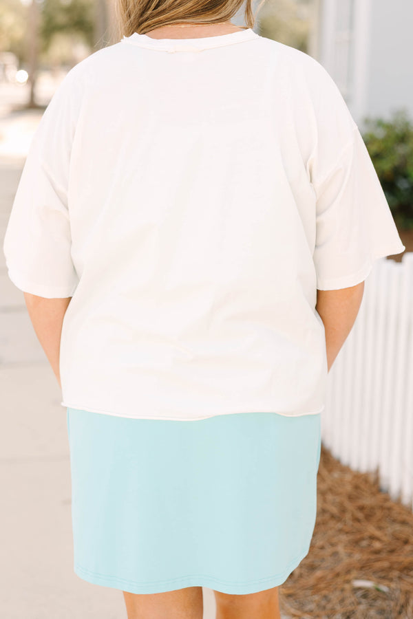 Chic Soul plus size clothing, white cropped tee with a multi colored abstract patterned sea shell in the middle