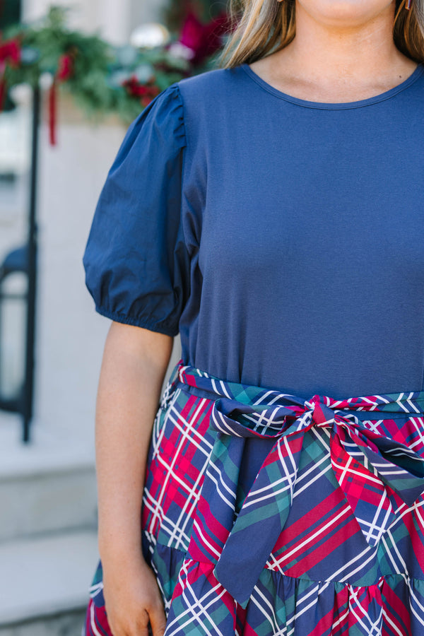 Plus Size navy blue short puff sleeve dress with a tiered plaid maxi skirt and waist tie.