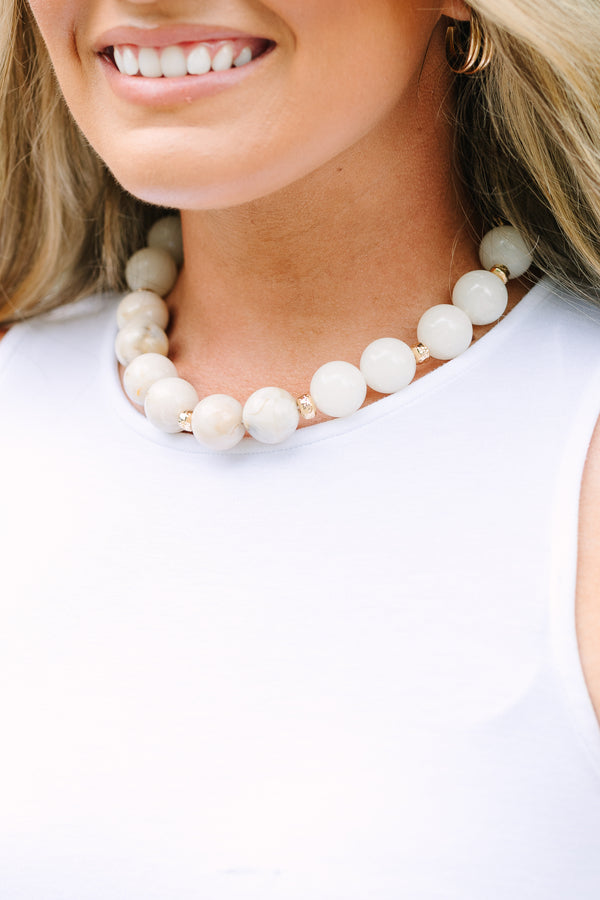 Plus Size ivory beaded necklace with gold spacers and an adjustable chain clasp.