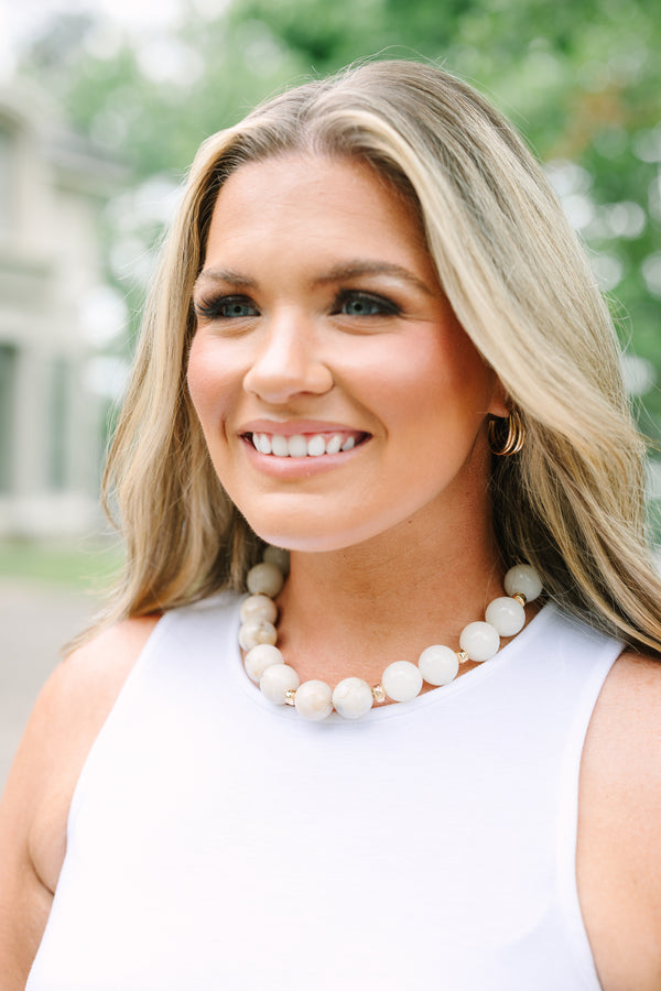 Plus Size ivory beaded necklace with gold spacers and an adjustable chain clasp.