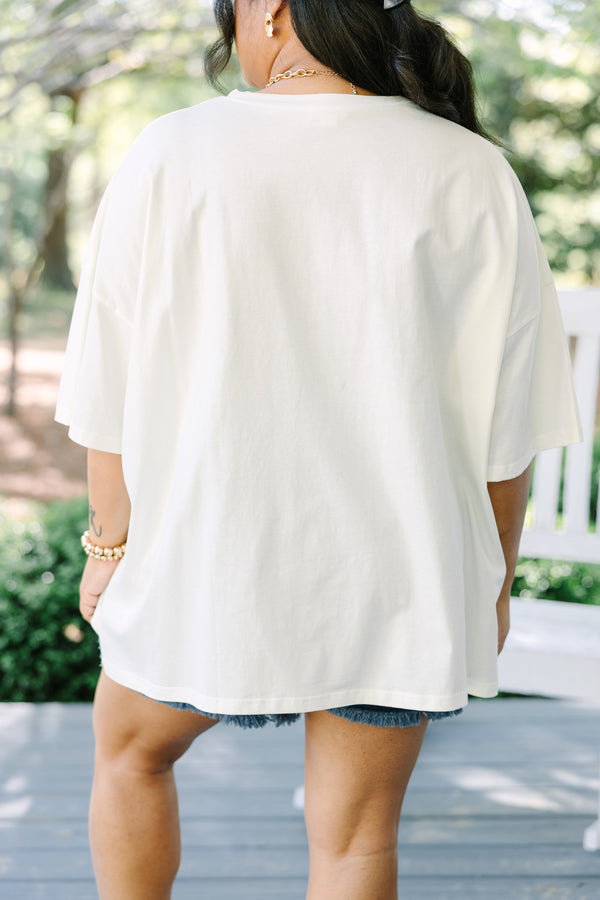 Chic Soul plus size clothing, ivory short sleeve graphic tee with a blue bow graphic in the center and a red and blue floral pattern filling the bow 