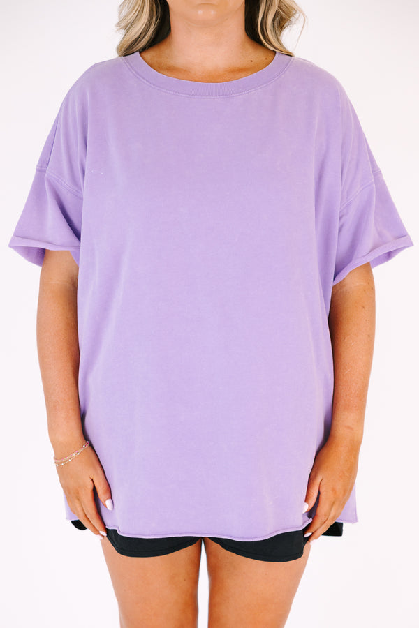 Chic Soul plus size clothing, a lavender short sleeve loose fitting shirt with rolled raw hems on the the shirt's body and sleeves. an exposed raw rolled hem is featured at center back