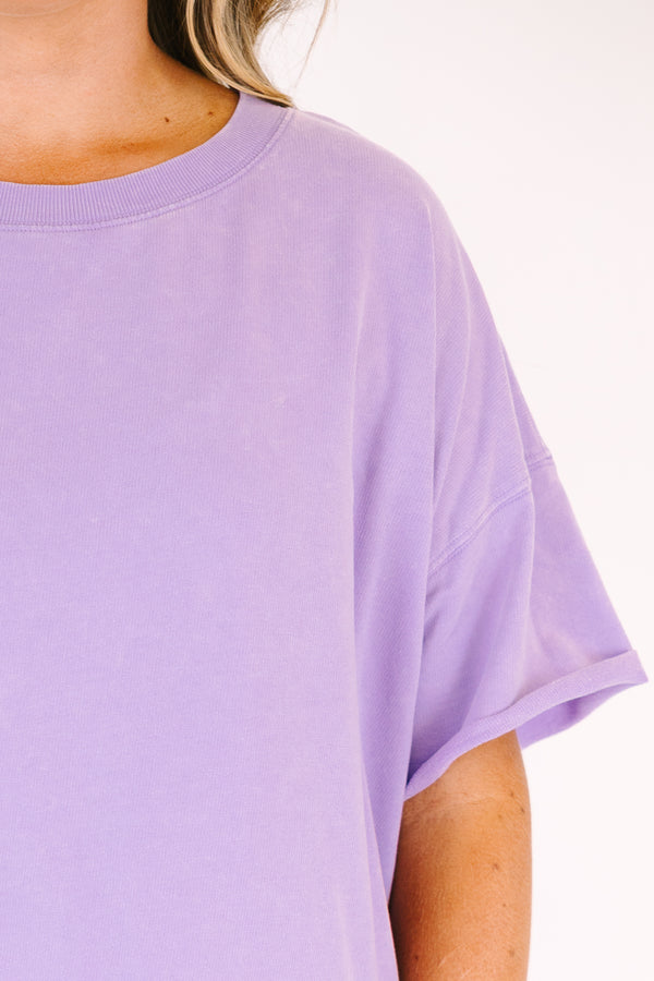 Chic Soul plus size clothing, a lavender short sleeve loose fitting shirt with rolled raw hems on the the shirt's body and sleeves. an exposed raw rolled hem is featured at center back