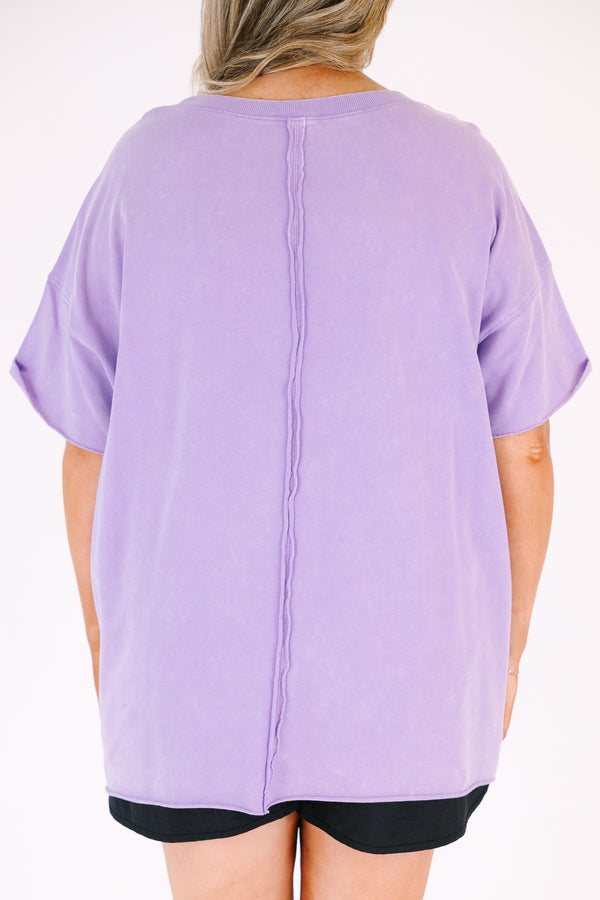 Chic Soul plus size clothing, a lavender short sleeve loose fitting shirt with rolled raw hems on the the shirt's body and sleeves. an exposed raw rolled hem is featured at center back