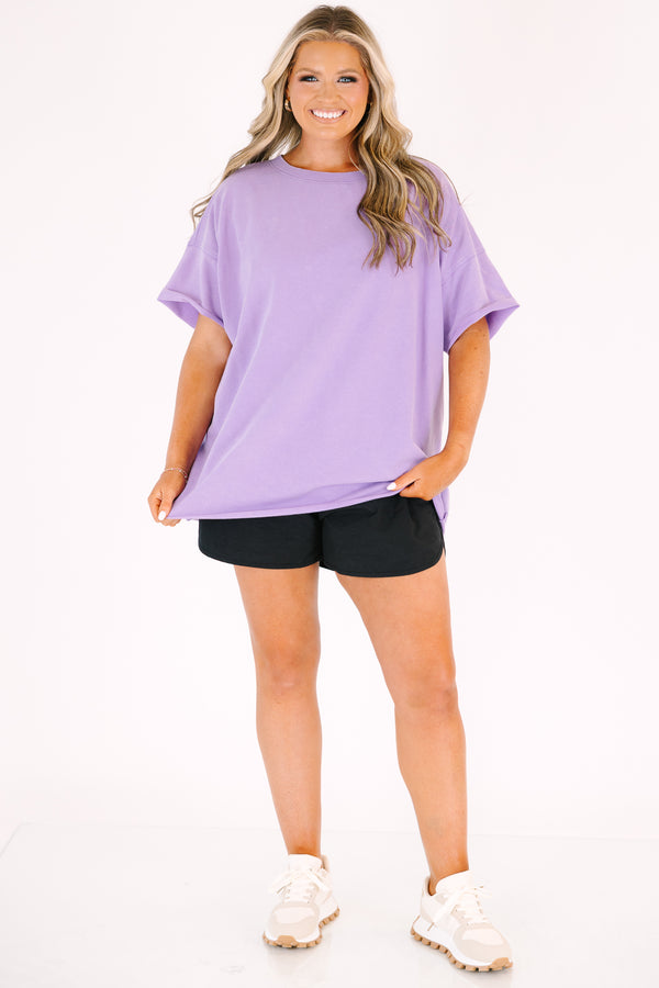 Chic Soul plus size clothing, a lavender short sleeve loose fitting shirt with rolled raw hems on the the shirt's body and sleeves. an exposed raw rolled hem is featured at center back