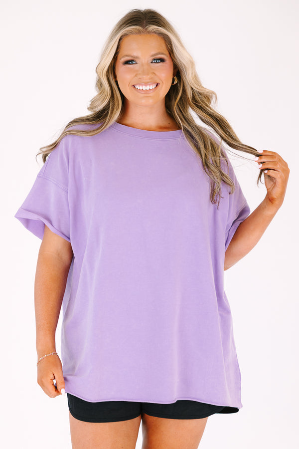 Chic Soul plus size clothing, a lavender short sleeve loose fitting shirt with rolled raw hems on the the shirt's body and sleeves. an exposed raw rolled hem is featured at center back