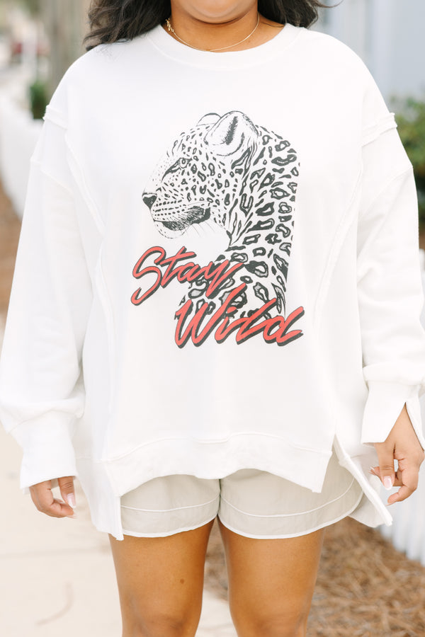 Chic Soul plus size clothing, ivory white crew neck pullover with a leopard side profile and “Stay Wild” text in a dark pink red script below it 

