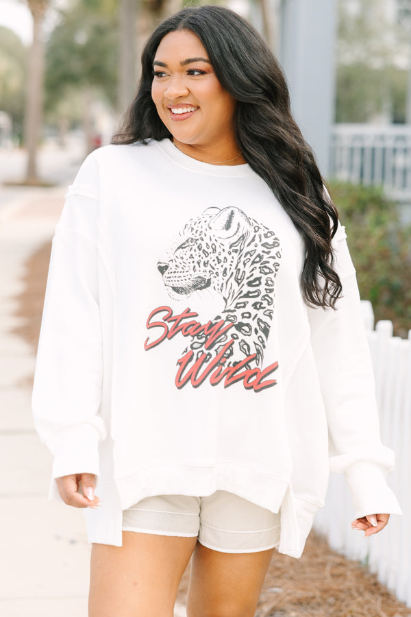 Chic Soul plus size clothing, ivory white crew neck pullover with a leopard side profile and “Stay Wild” text in a dark pink red script below it 
