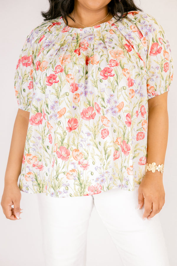 Chic Soul plus size clothing, white top with short bubble sleeves that has a green floral pattern throughout 