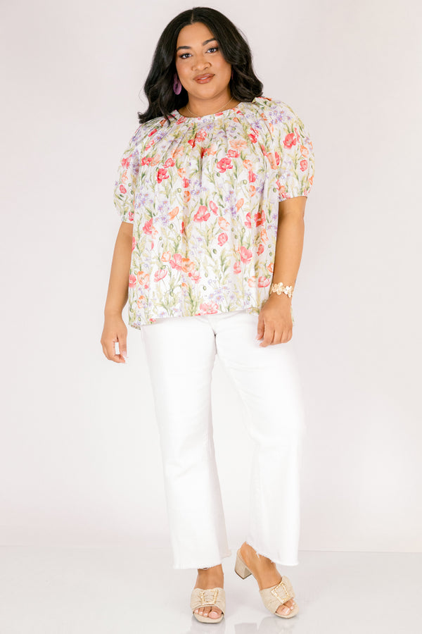 Chic Soul plus size clothing, white top with short bubble sleeves that has a green floral pattern throughout 