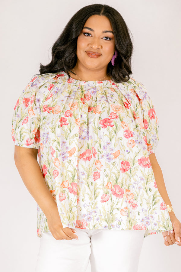 Chic Soul plus size clothing, white top with short bubble sleeves that has a green floral pattern throughout 