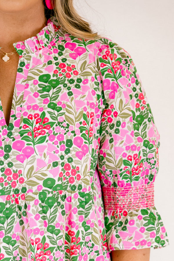 Chic Soul plus size clothing, pink multi color knee length dress with half sleeves that have a ruffle detail on the bottom of each sleeve and pink stitching details above the ruffle as well as a floral pattern 