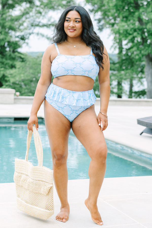 Plus Size high-waisted light blue bikini bottoms with a ruffled waist and dark blue ribbon pattern.