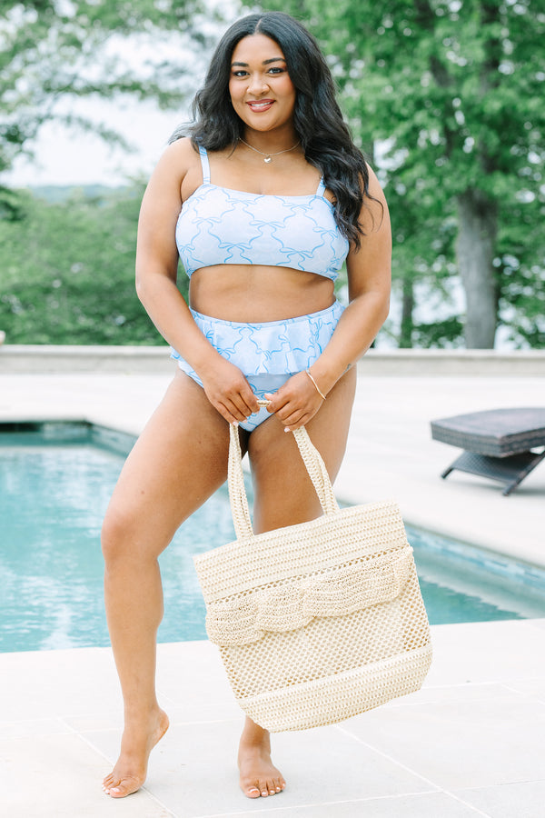 Plus Size high-waisted light blue bikini bottoms with a ruffled waist and dark blue ribbon pattern.