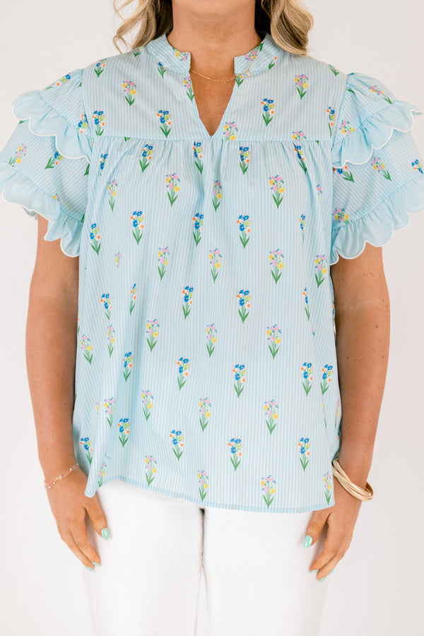 Chic Soul plus size clothing, light aqua blue short ruffle sleeve top with v-neckline and small orange, purple, green, and yellow floral print on vertical white pin stripe pattern