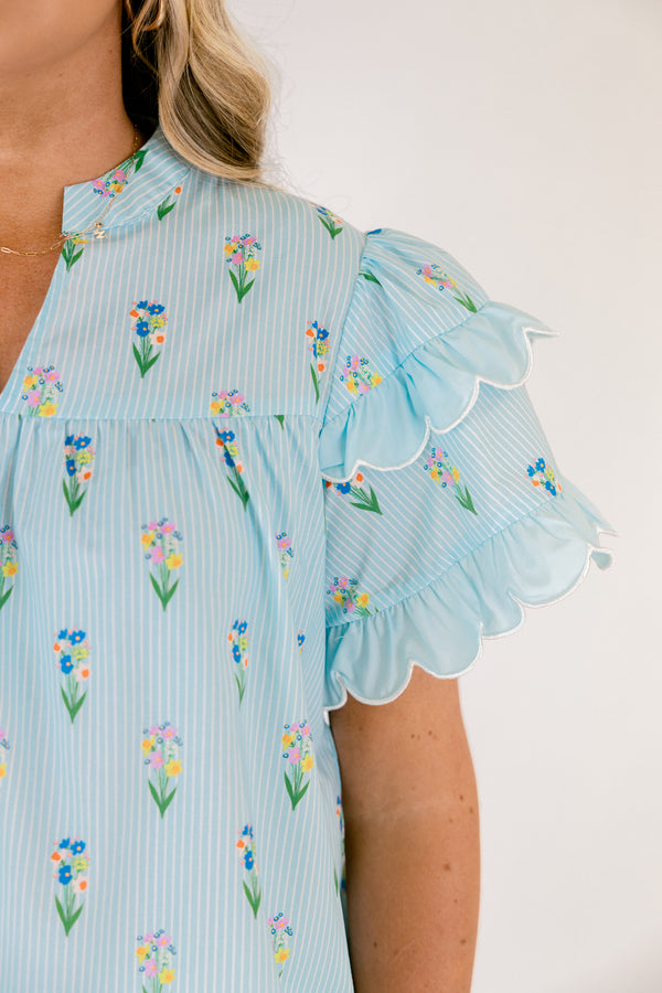 Chic Soul plus size clothing, light aqua blue short ruffle sleeve top with v-neckline and small orange, purple, green, and yellow floral print on vertical white pin stripe pattern