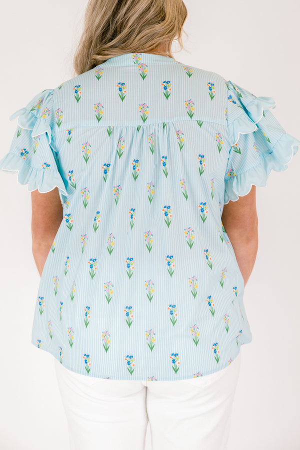 Chic Soul plus size clothing, light aqua blue short ruffle sleeve top with v-neckline and small orange, purple, green, and yellow floral print on vertical white pin stripe pattern