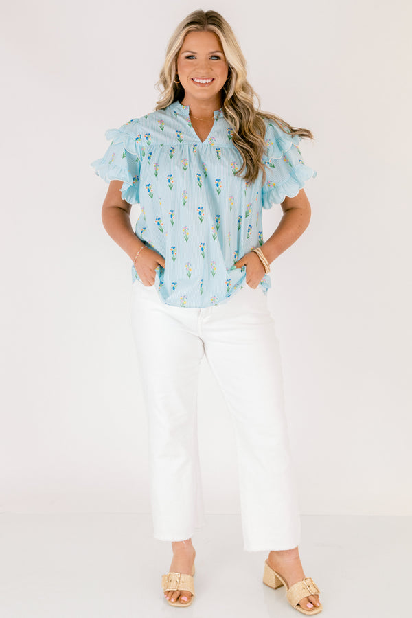 Chic Soul plus size clothing, light aqua blue short ruffle sleeve top with v-neckline and small orange, purple, green, and yellow floral print on vertical white pin stripe pattern