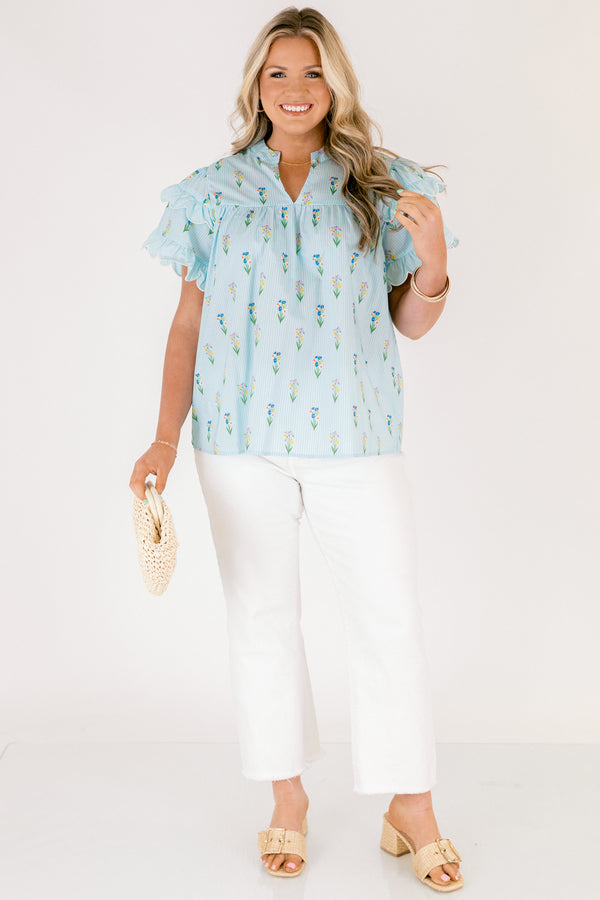 Chic Soul plus size clothing, light aqua blue short ruffle sleeve top with v-neckline and small orange, purple, green, and yellow floral print on vertical white pin stripe pattern