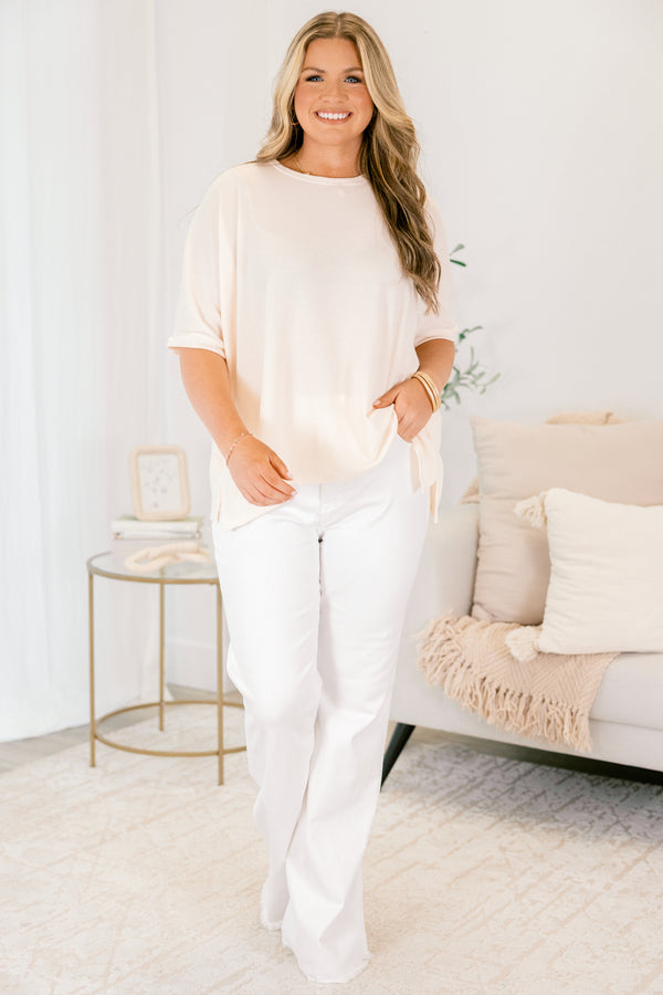 Chic Soul plus size clothing, white flared jeans with front pockets and fringe details at the bottom of each pant leg 