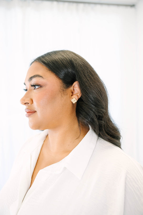 Plus Size Gold four-leaf clover stud earrings with a textured, sunburst finish and beaded edges.