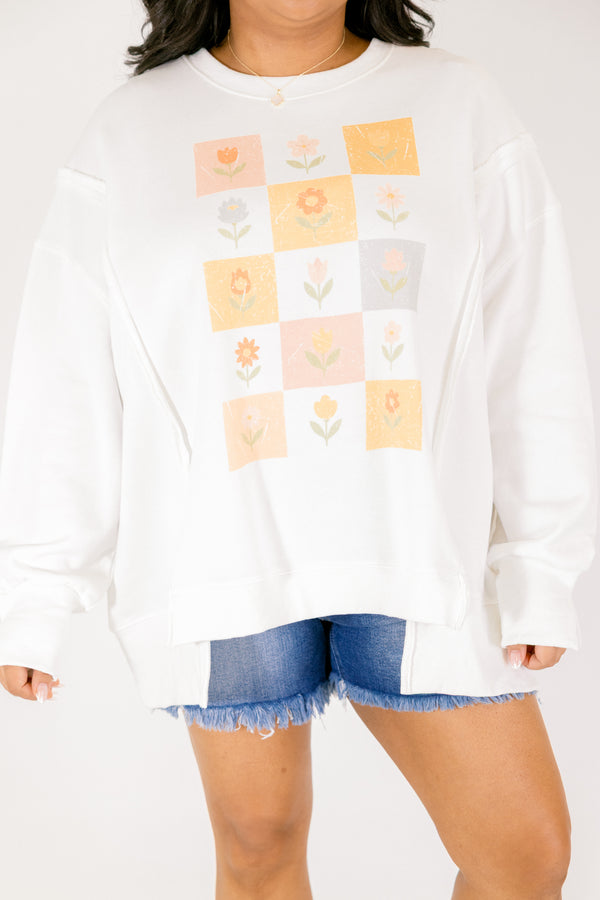 Chic Soul plus size clothing, off white long sleeve crew neck with checkerboard and flower graphic