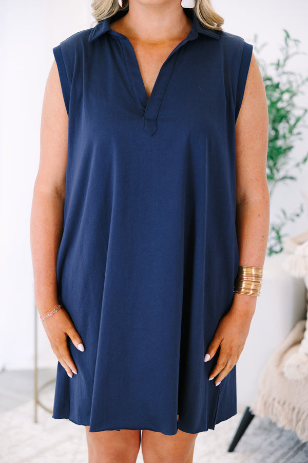 Plus Size navy blue sleeveless shift dress with a collared V-neckline.