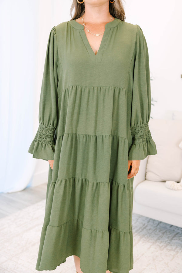 Plus size forest green tiered midi dress with a flowy fit, V-neckline, and ruffled sleeves.