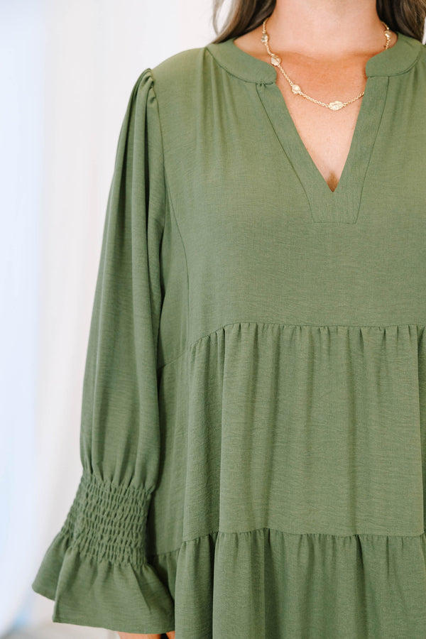 Plus size forest green tiered midi dress with a flowy fit, V-neckline, and ruffled sleeves.