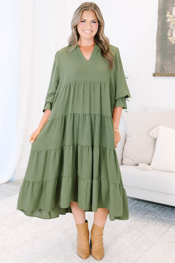 Plus size forest green tiered midi dress with a flowy fit, V-neckline, and ruffled sleeves.