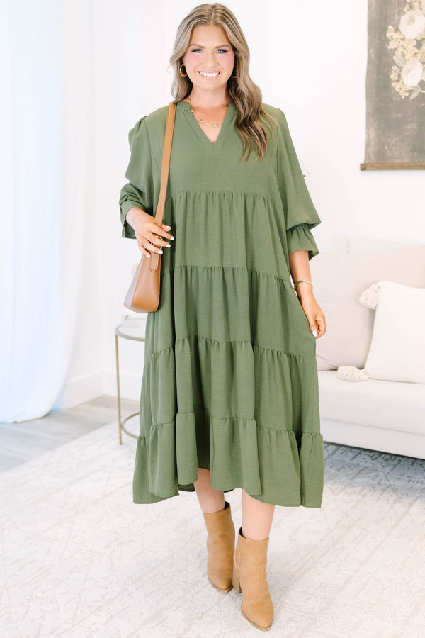 Plus size forest green tiered midi dress with a flowy fit, V-neckline, and ruffled sleeves.