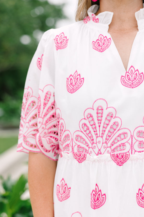 Plus Size white babydoll dress with pink eyelet embroidery, split v-neckline, and tiered skirt.