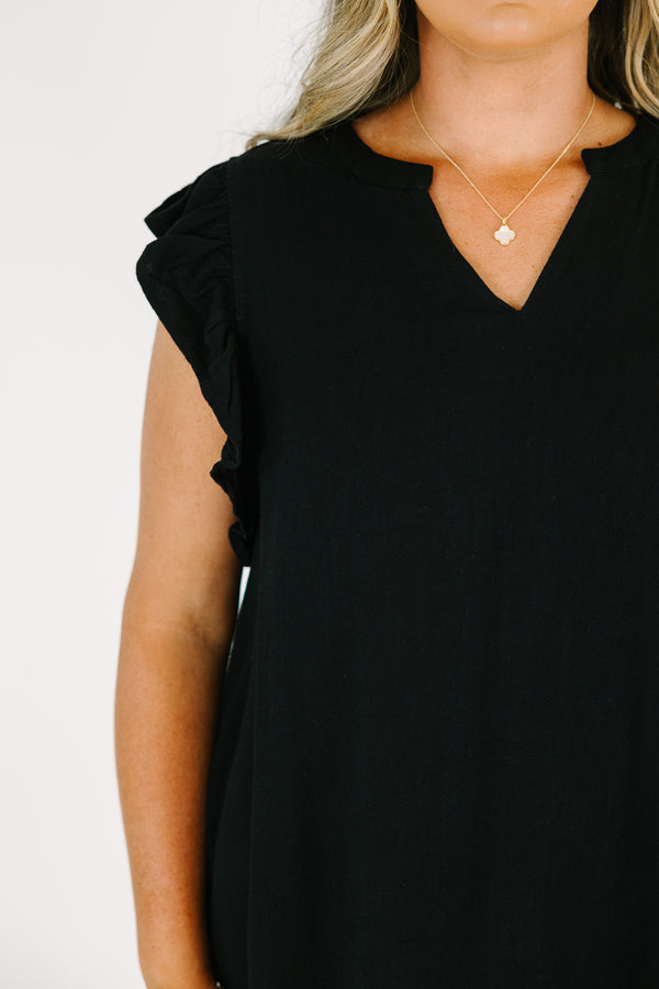 Plus Size black v-neck top with ruffled cap sleeves and a relaxed fit.