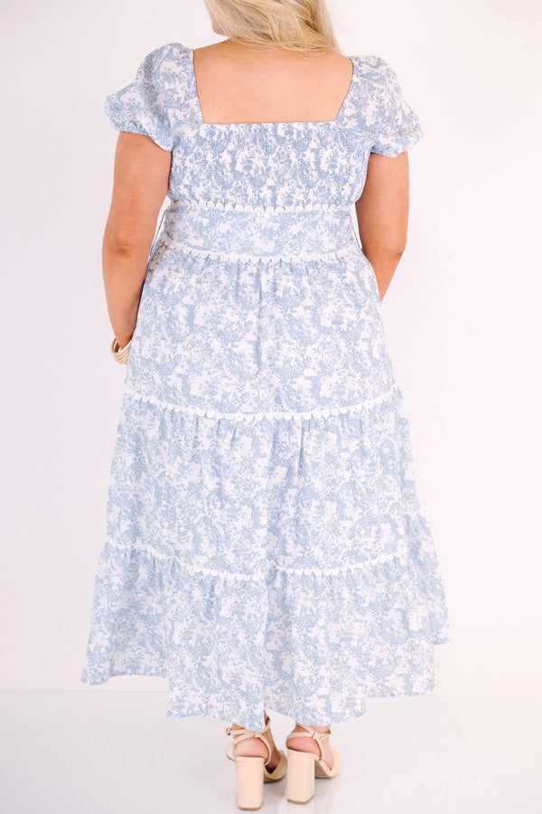 Chic Soul plus size clothing, blue and white toile print short puff sleeve square neck tiered maxi dress with bow tying at the waist and white scalloped trim around each tier and along the slides of the bow 
