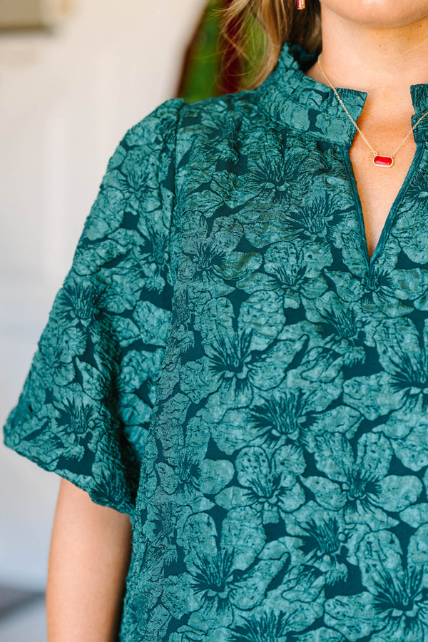 Plus Size green floral jacquard top with a split neckline and short puff sleeves.