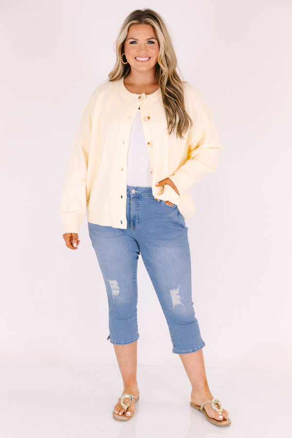 Chic Soul plus size clothing, medium wash blue jean capris with distressing on each knee 