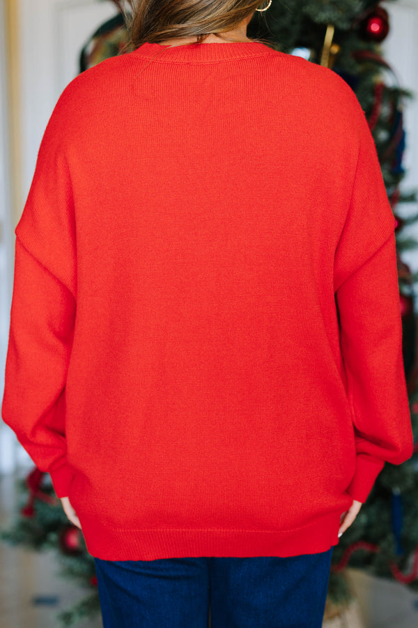 Plus Size red oversized crewneck sweater with sequined bow designs and long sleeves.