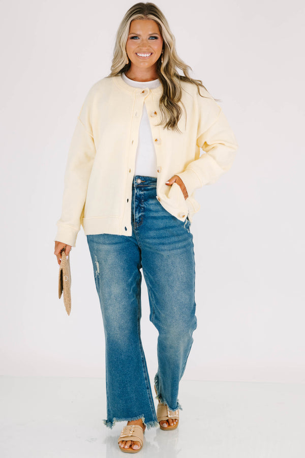 Plus Size vintage wash wide leg jeans with a high waist, distressed details, and frayed hems.