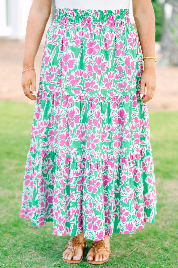 Plus Size tiered maxi skirt in a pink and green floral print with an elastic waistband.